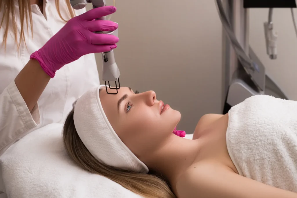 Woman receiving a SmartXides Facial Treatment in Ventura, CA | IWH MedSpa